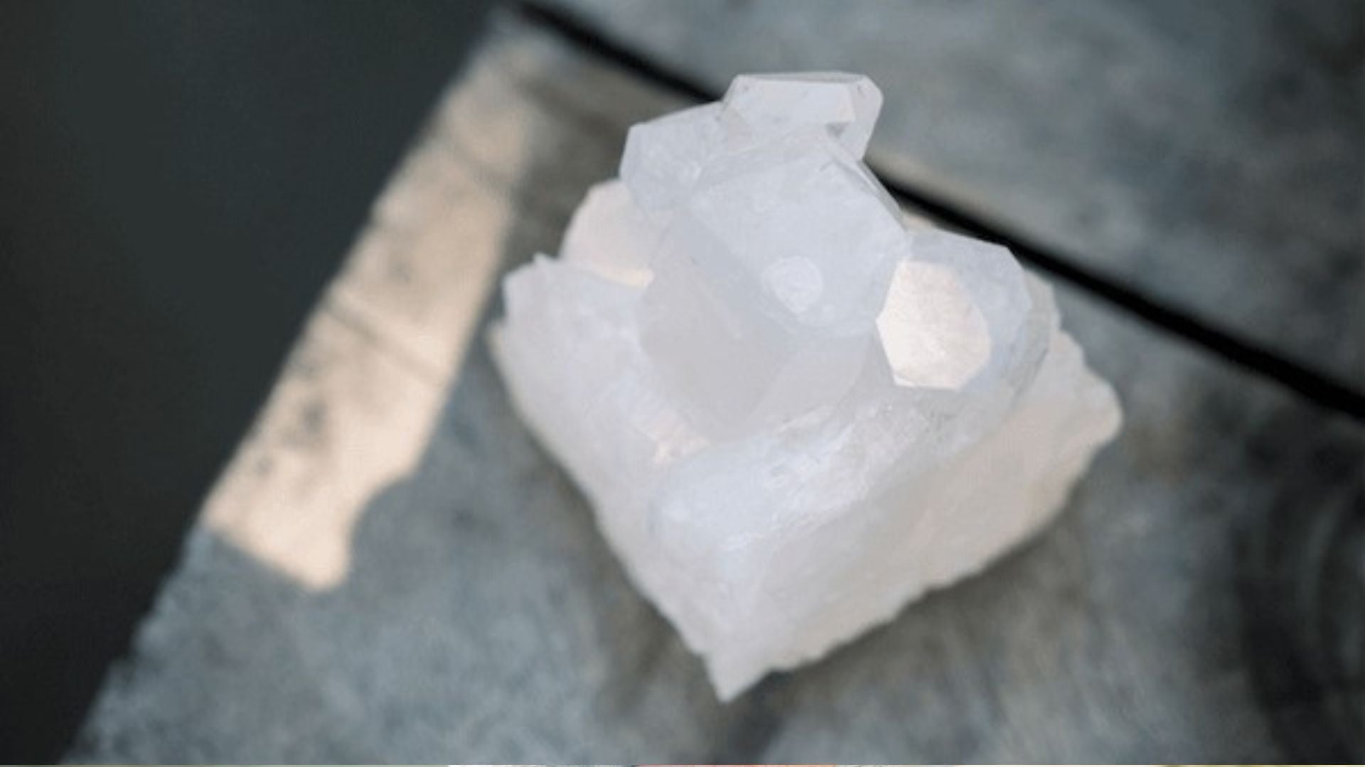 quartz crystal on a grey background