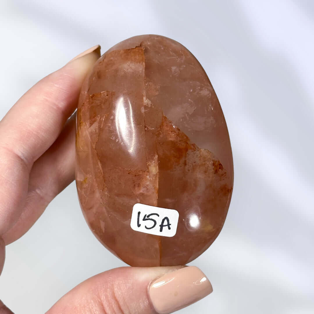 Red Hematoid in Quartz Palm Stone | Stock