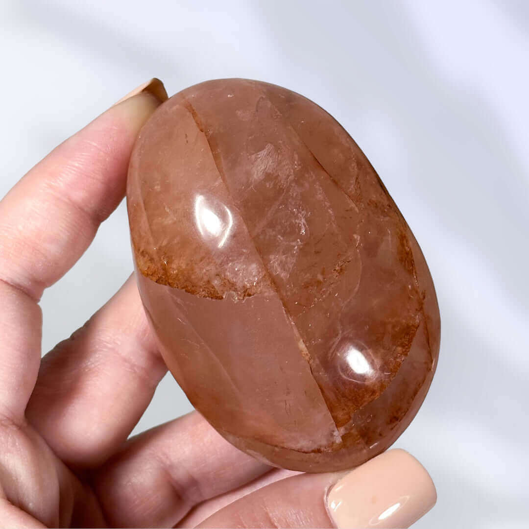 Red Hematoid in Quartz Palm Stone | Stock