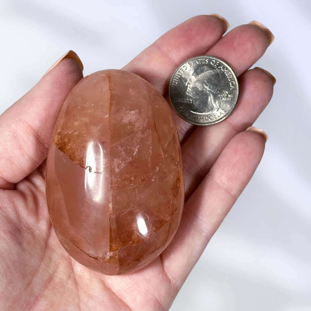 Red Hematoid in Quartz Palm Stone | Stock