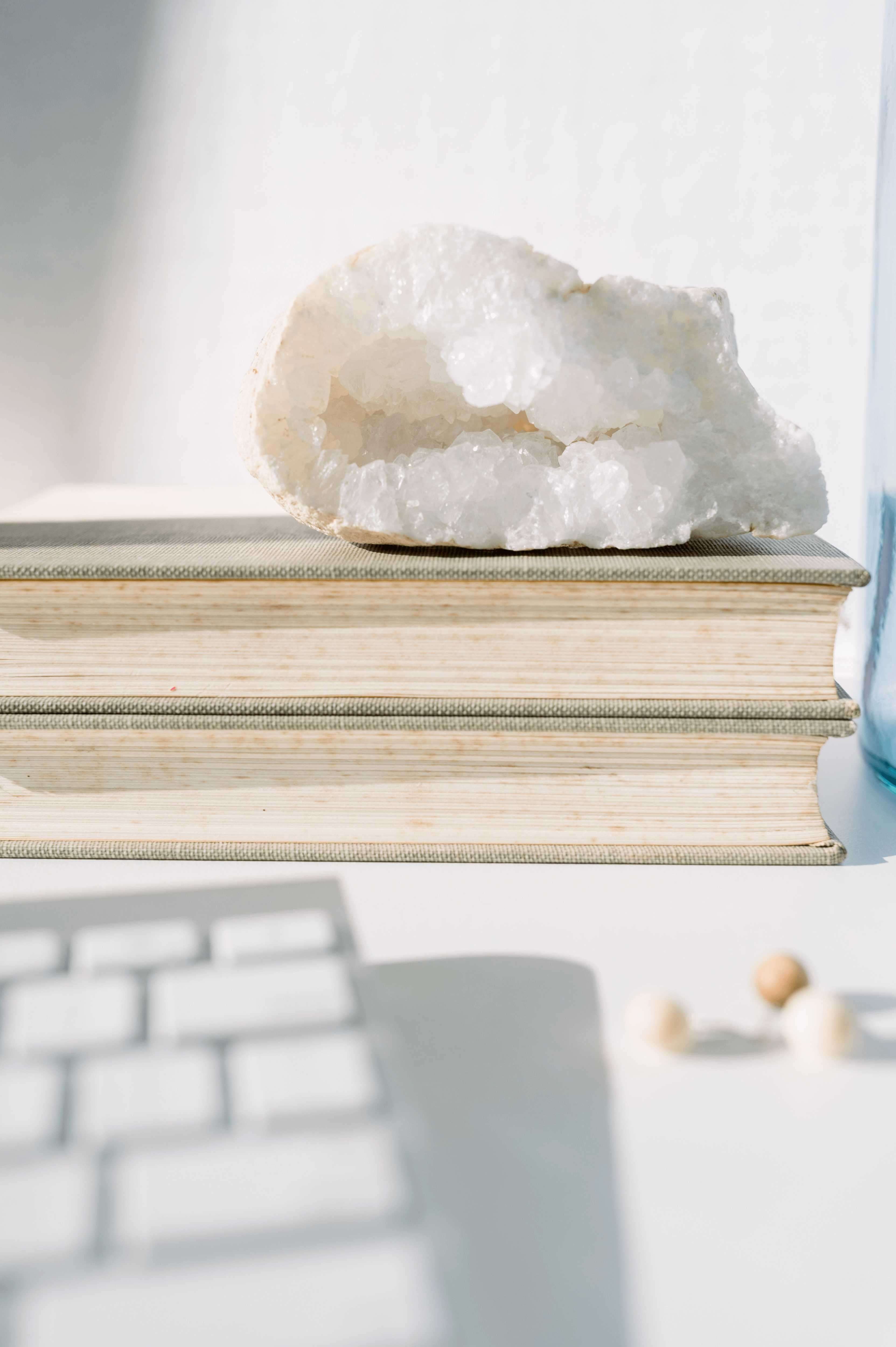 Crystal geode as decor on top of a stack of books