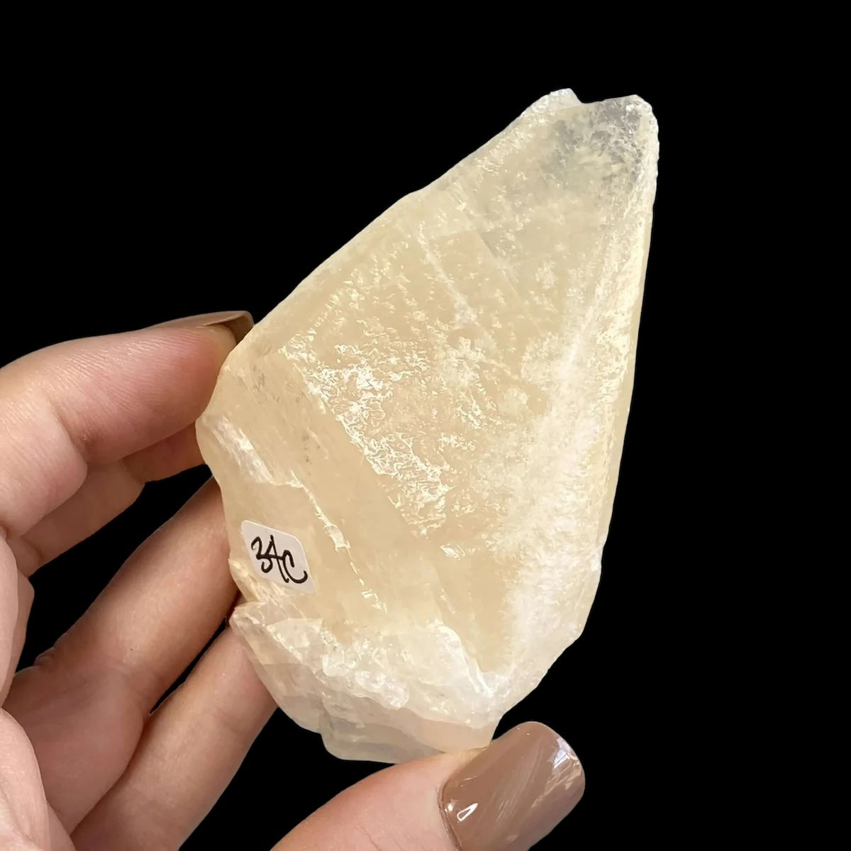 Rare UV-reactive Etched Calcite Point | Stock C